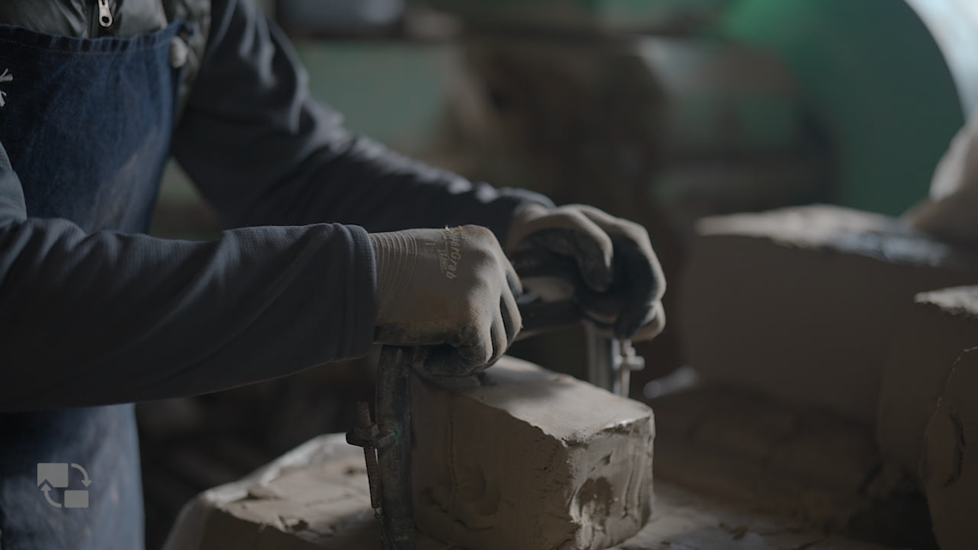 Artisan hands working with mosaic tiles