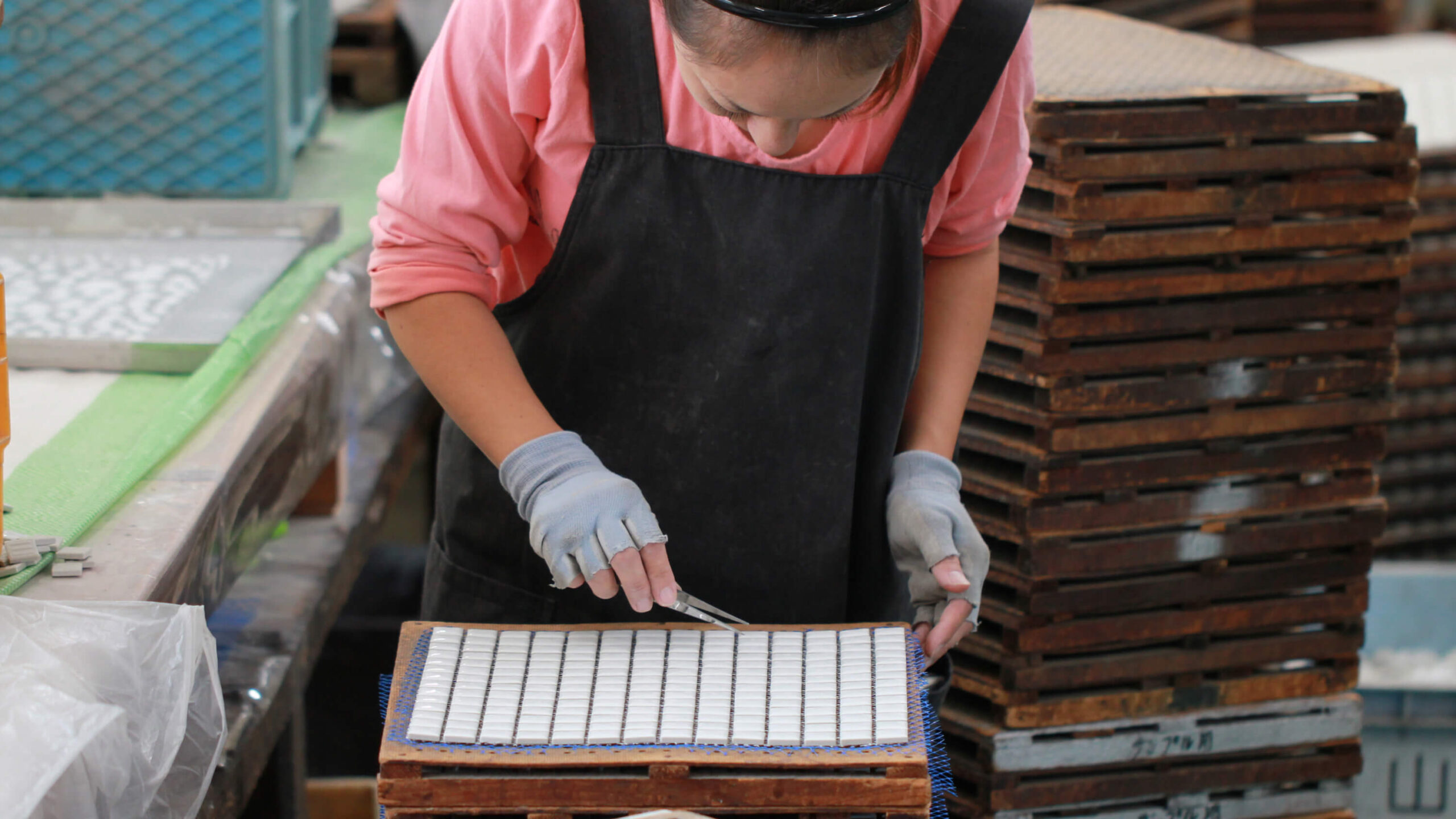 In-house hand assembly area for mosaic tile sheets